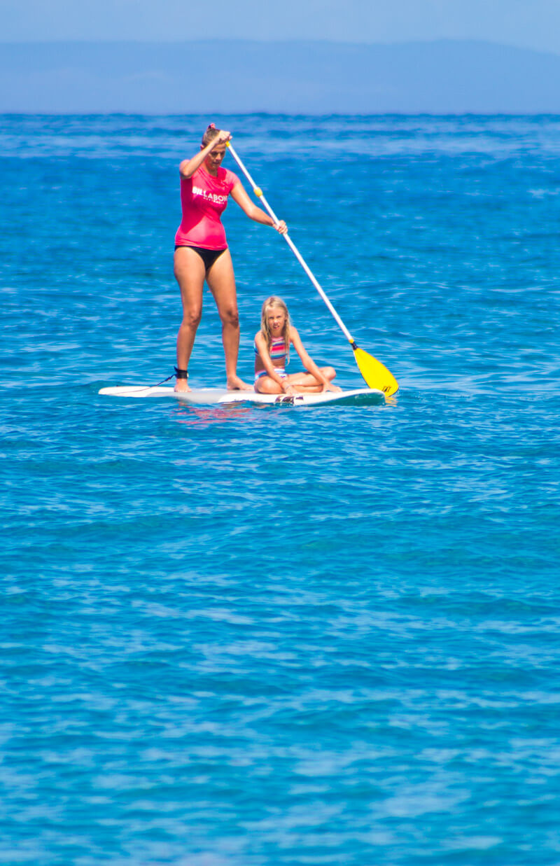 Stand up paddle boarding at Kaanapali Beach on the island of Maui in Hawaii