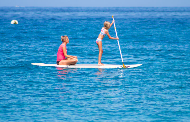 Stand up paddle boarding at Kaanapali Beach on the island of Maui in Hawaii