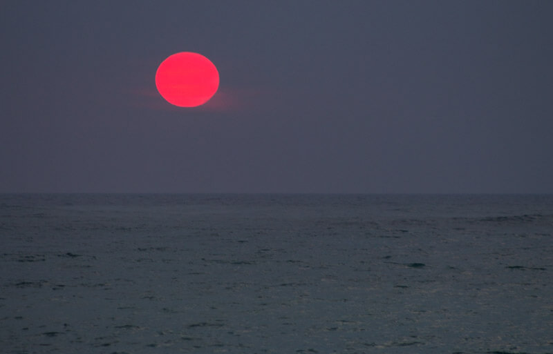 Pink sunset at Sunset drinks at Lava Lava Beach Club, Waikoloa, Hawaii