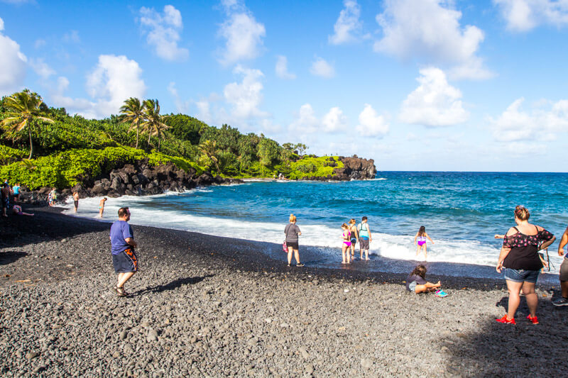 black sand beach named Pai’iloa Beach, one of the best stops along the Road to Hana drive in Maui, Hawaii