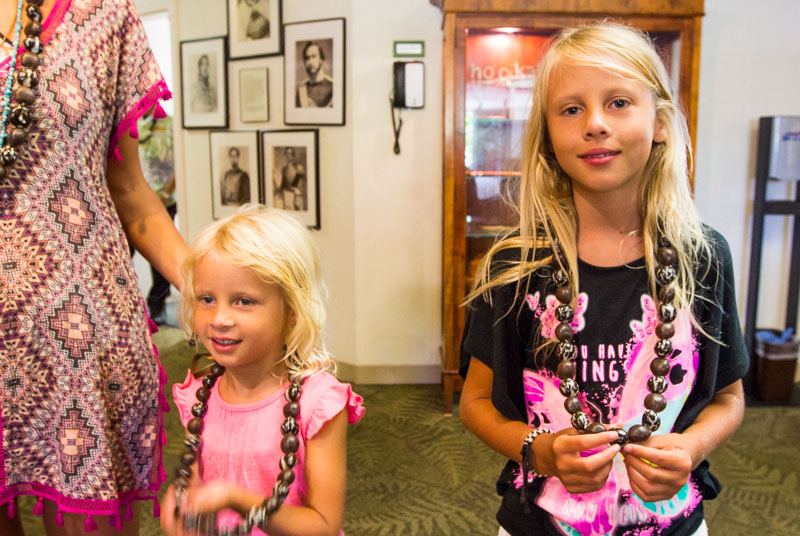 Our kids with their kukui nut lei necklaces 