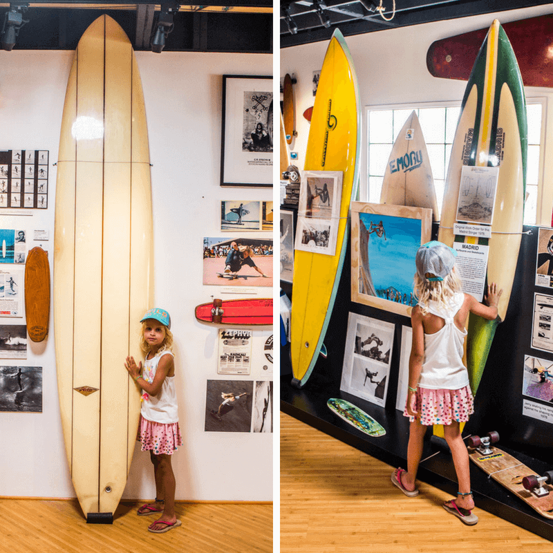 girl looking at surfboards Surfing museum in Huntington Beach, California