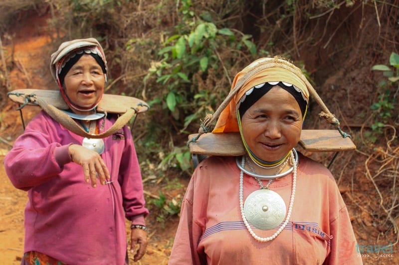 two akha hill tribe women walking