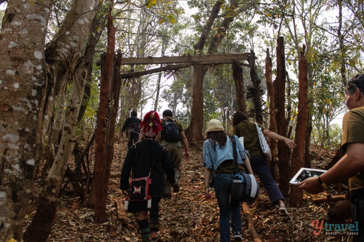 Akha hill tribe people walking up mountain