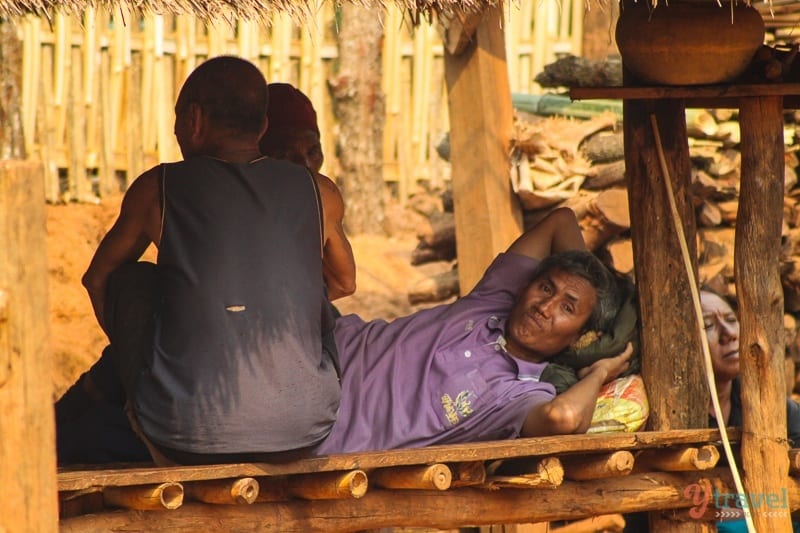 Akha hill tribe men lying down