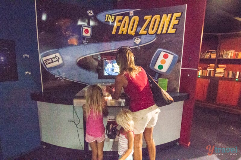 people doing an interactive museum exhibit