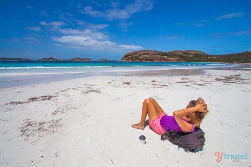 woman laying on the beach