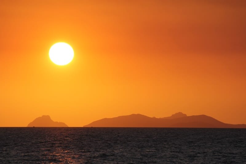 A sunset over a body of water