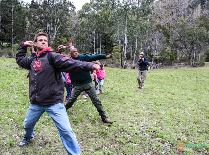 people throwing boomerangs