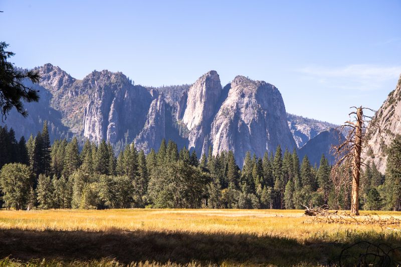 cathedral rock rising up from yosemite valley