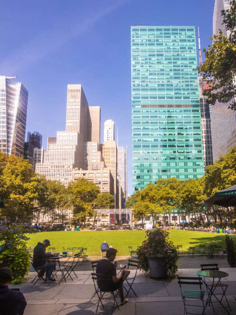 people sitting aorund Bryant Park NYC