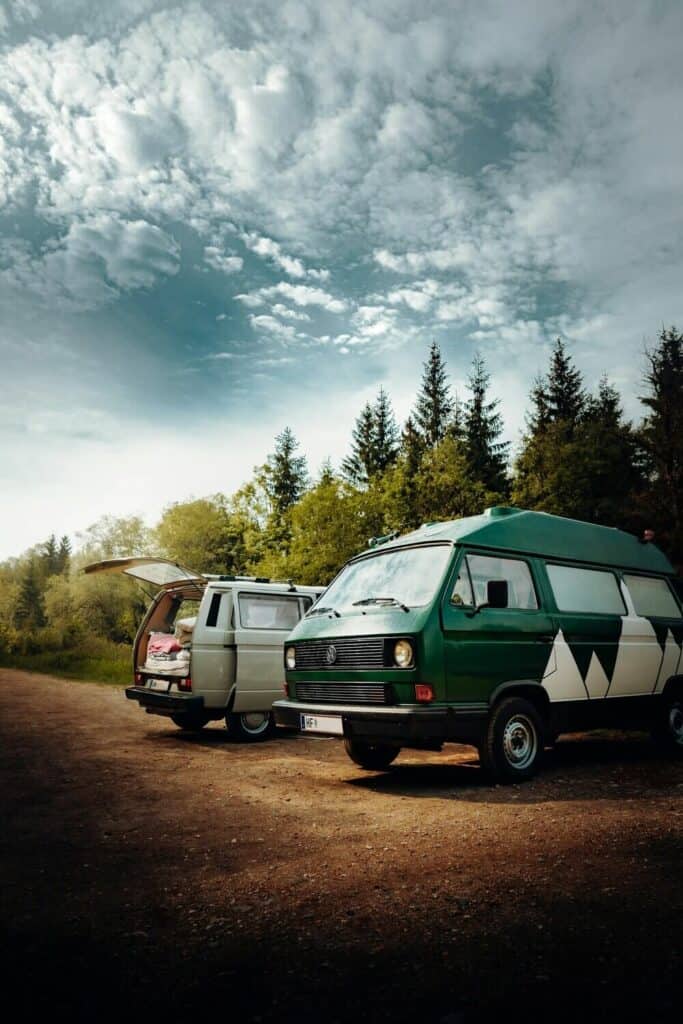 campervans in forest