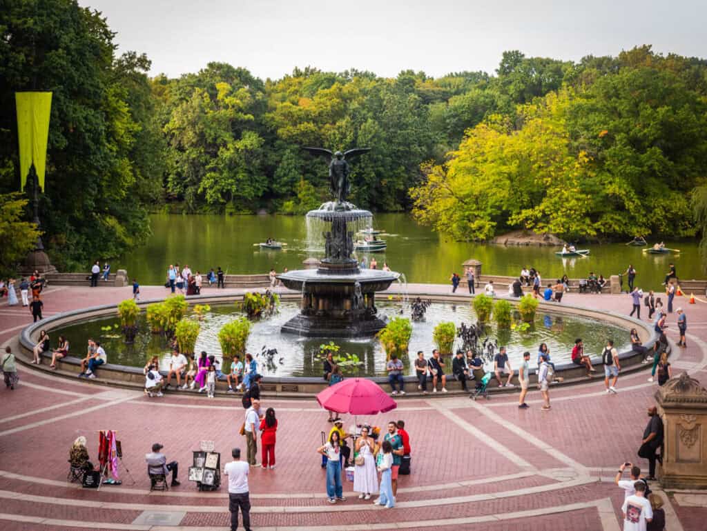 bethseda fountain with pond behind it at central park