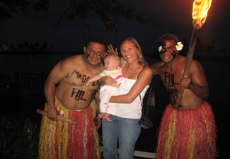 woman and child with fijian danceers