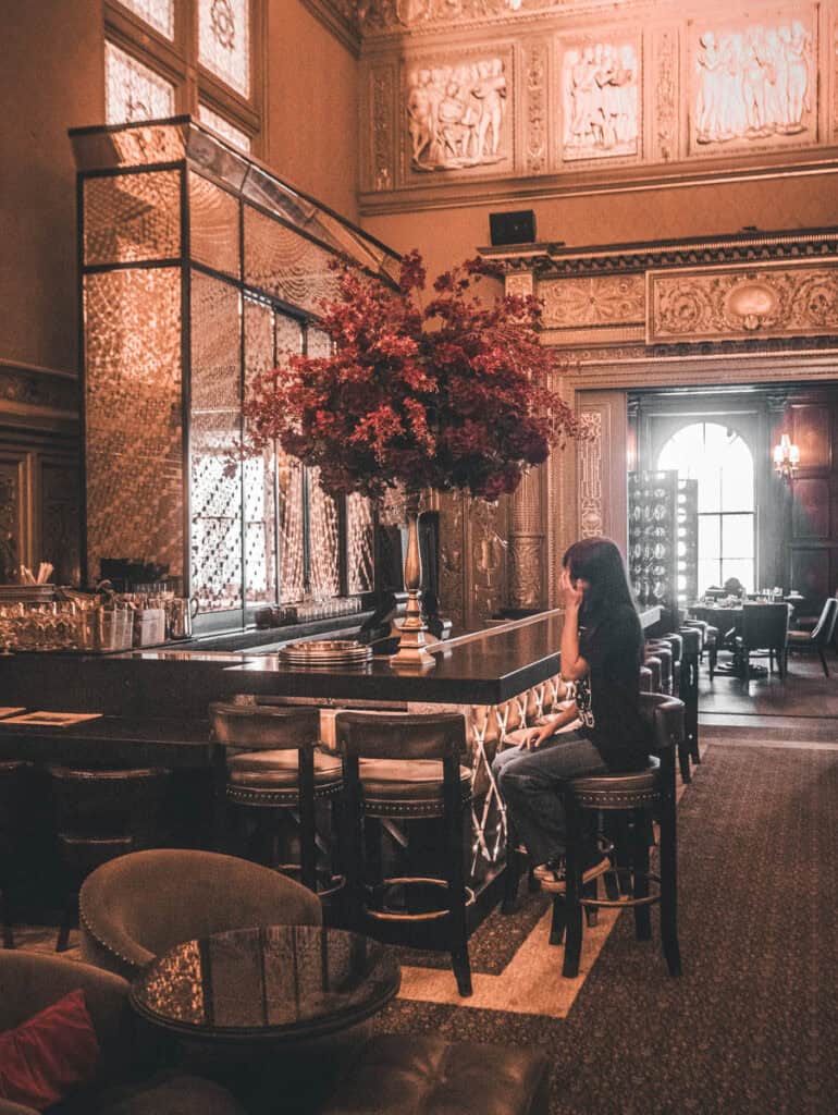 girl sitting at cocktail bar