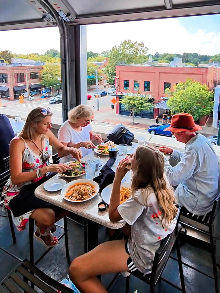 family eating at top of the hill