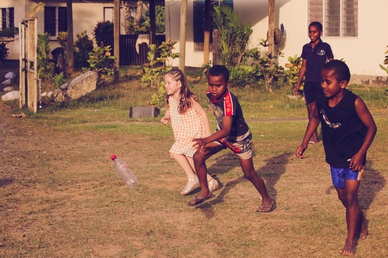 fijian kids running with white girl