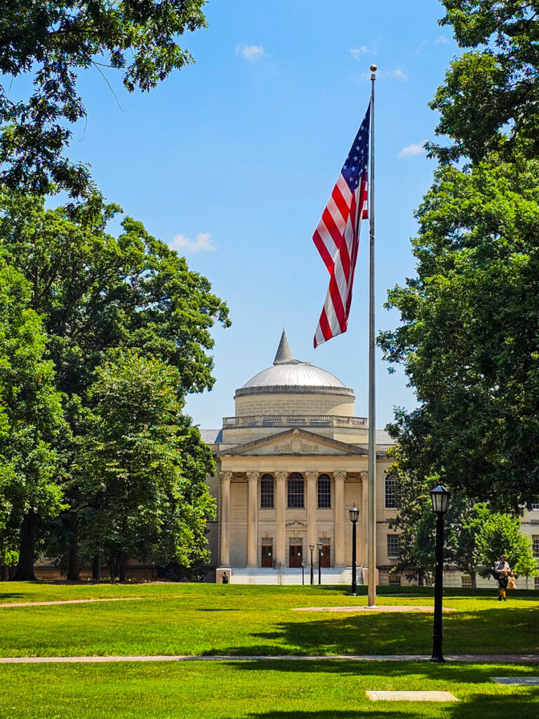 building on unc campus with flag out front