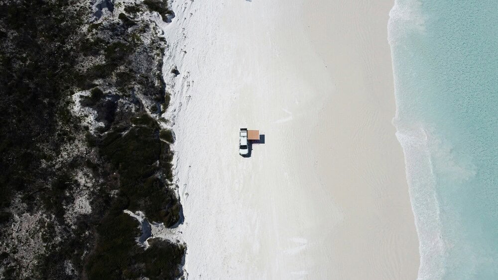 aerial of car on beach