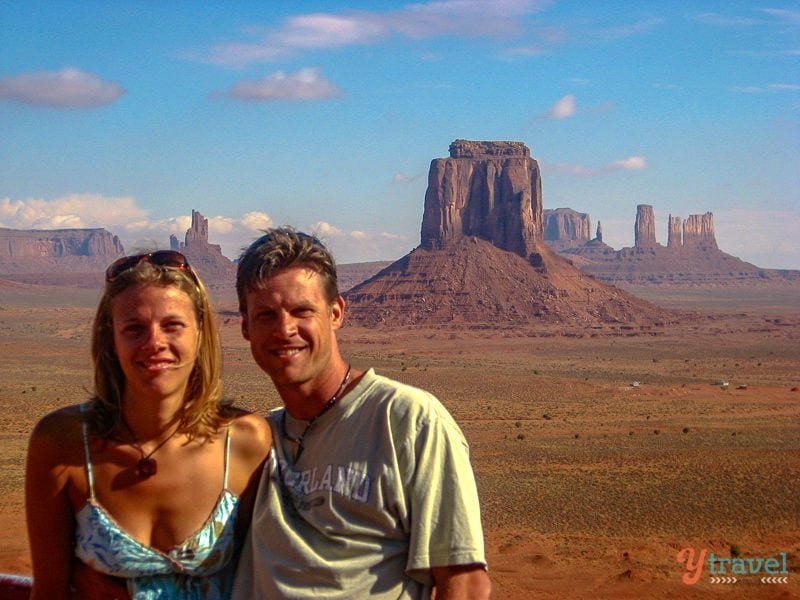 couple posing in front of monument valley