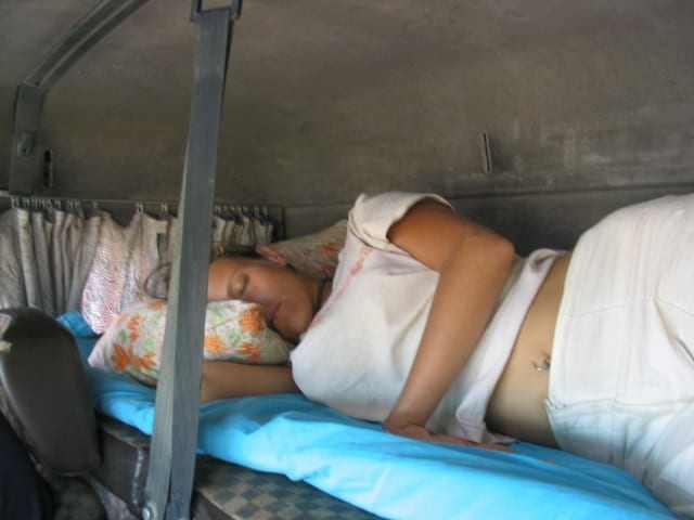 woman sleeping int truck cabin