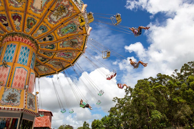 people enjoying the swinging chair at Aussie World