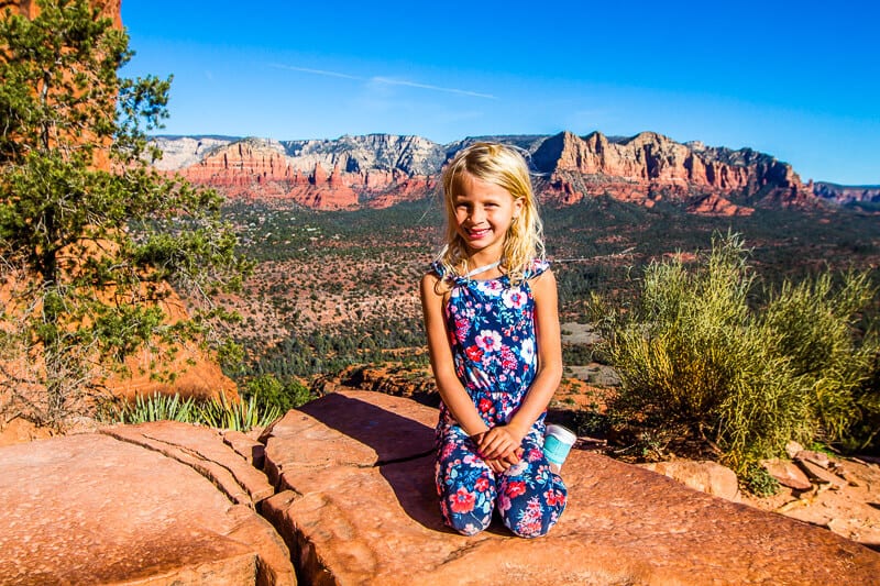 girl sitting on rocks in sedona