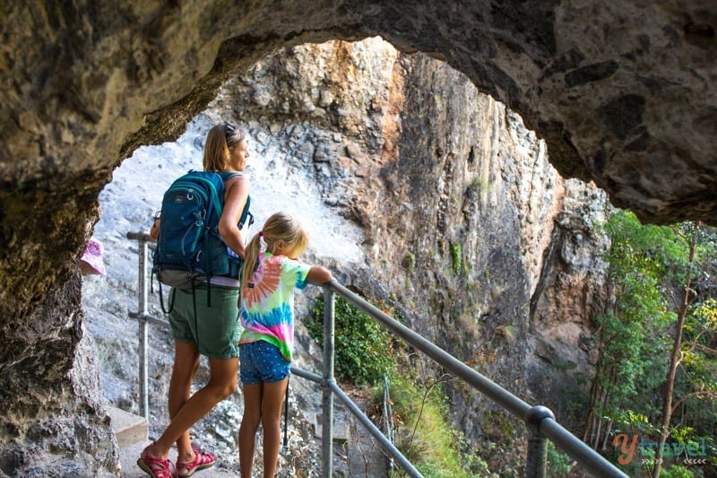 people standing in a cave