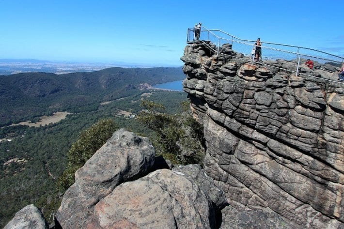 people standing on a rocky cliff