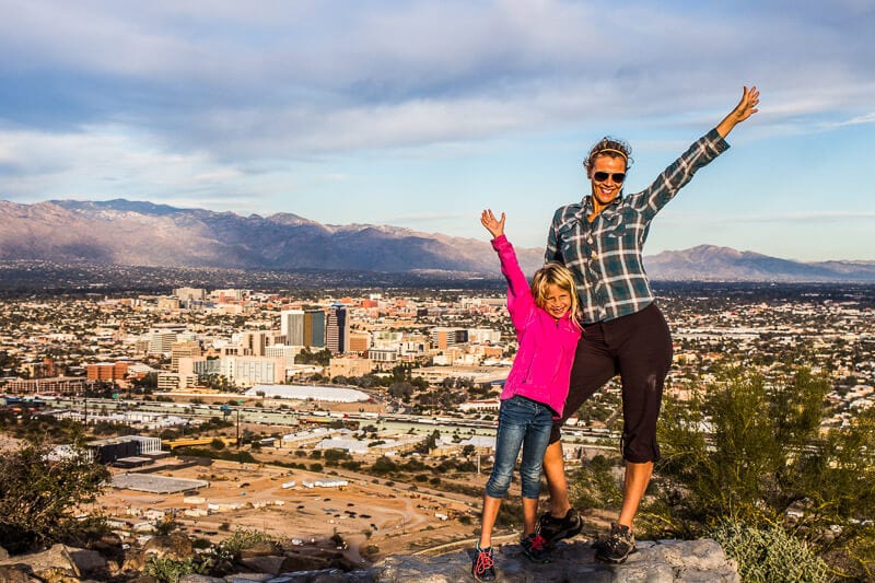 woman and child posing on A-Mountain to overlook Downtown Tucson