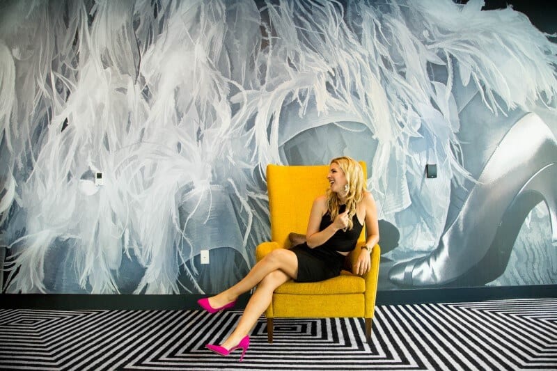 woman sitting in lobby chair at Indigo Hotel in downtown los angeles (2)