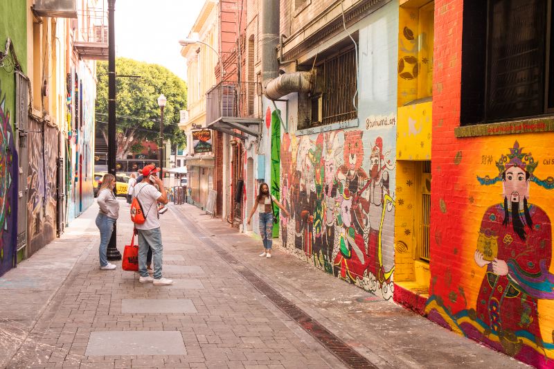 people looking at murals in Jack Kerouac Alley San Francisco