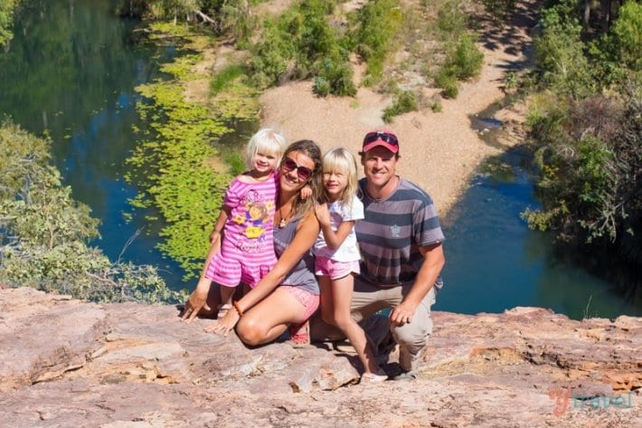 family posing on cliff over river view at Budjamulla National Park in Queensland