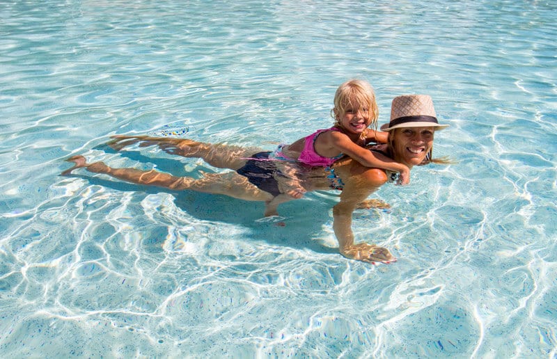 mother and child swimming