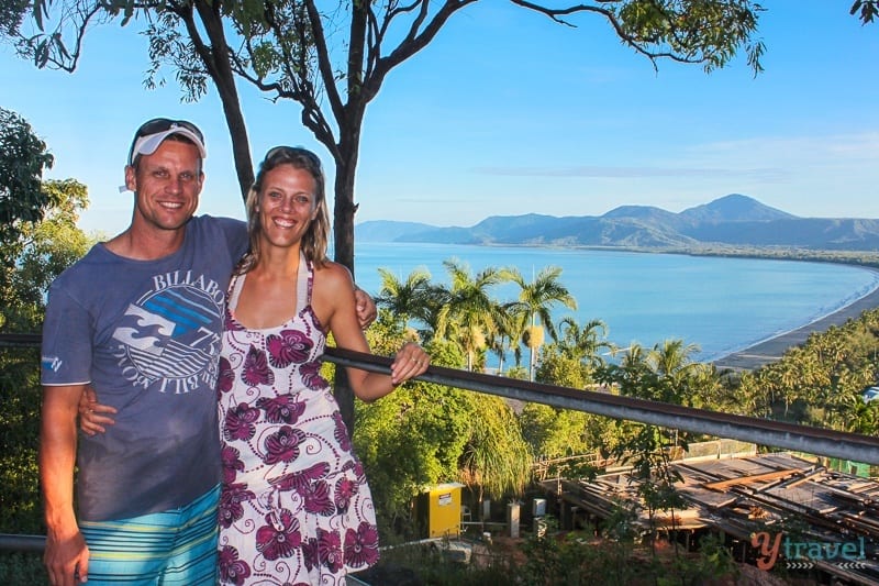 people posing to camera with view of 4 mile beach behind them