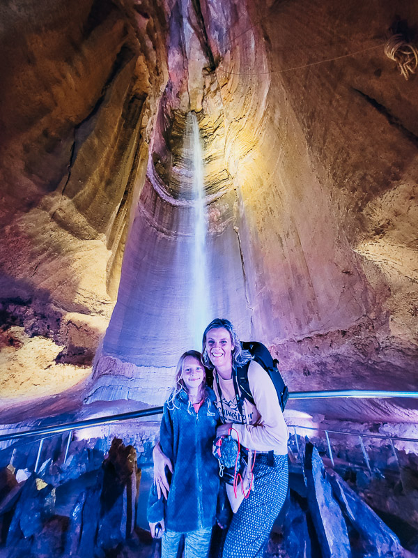 mother and child posing in front of ruby falls