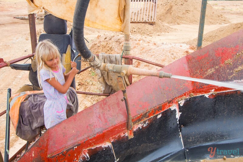 girl using old mining equipment