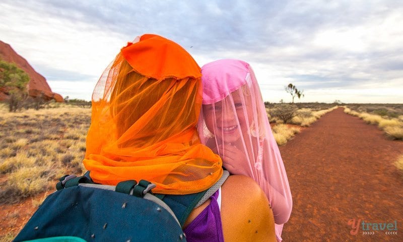 woman and child hiking wearing fly nets