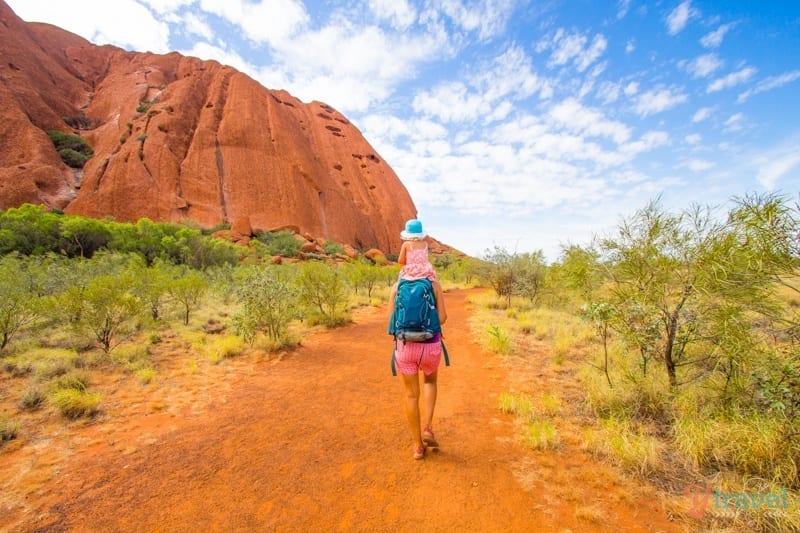 A person walking down a dirt road