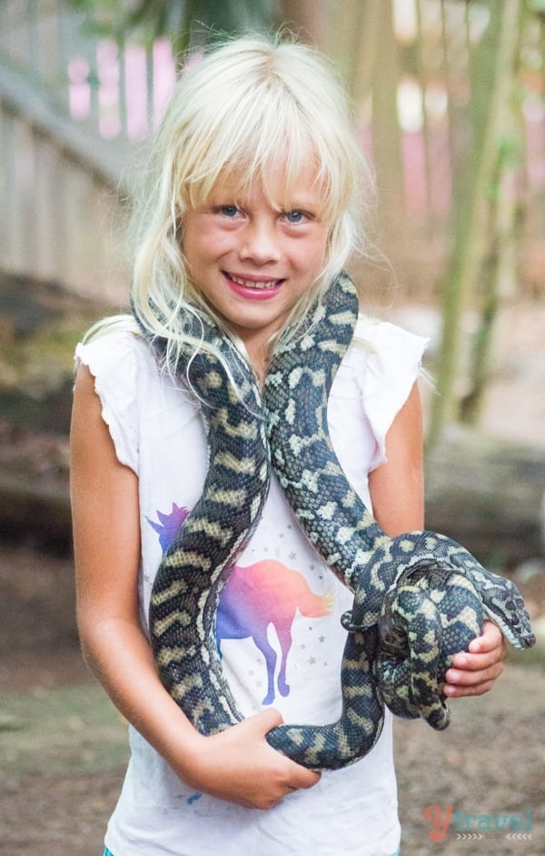 girl holding a snake