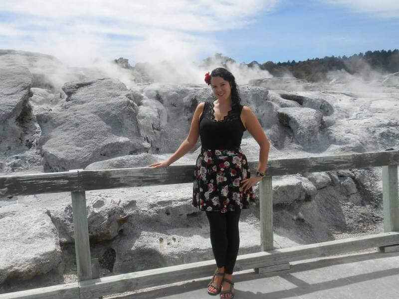 woman standing in front of geyser