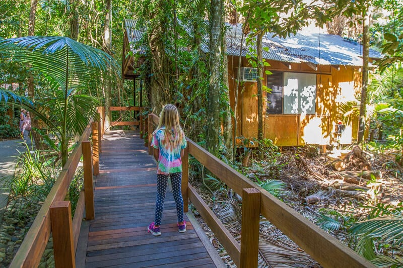 girl walking up to Cape Trib Beach House