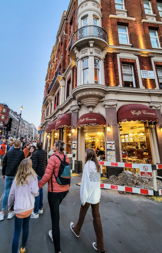 family walking around Covent Garden, London