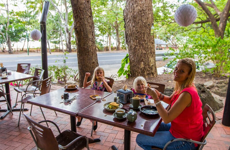 family eating at table at Ellis Beach Bar & Grill  with ocean views