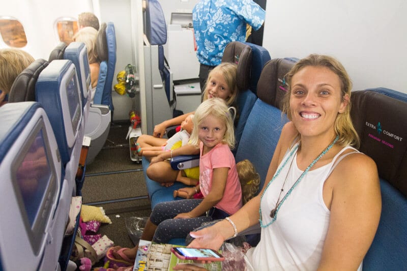 family sitting on Extra Comfort seats flying to Hawaii on Hawaiian Airlines