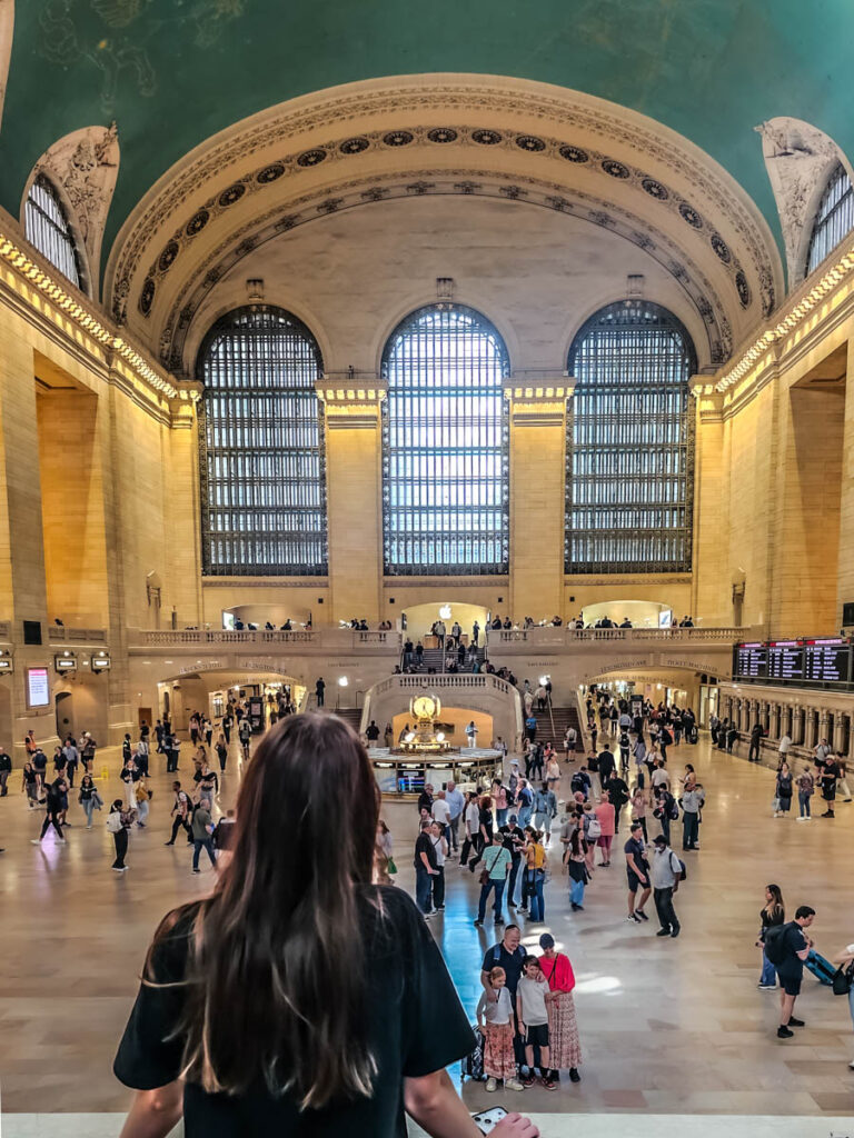 girl looking over grand central terminal 