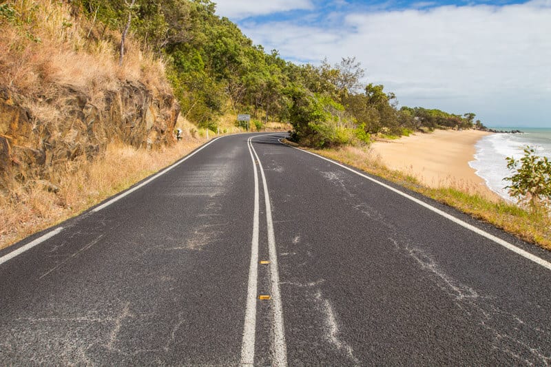 road winding beside ocean on great barrier reef drive