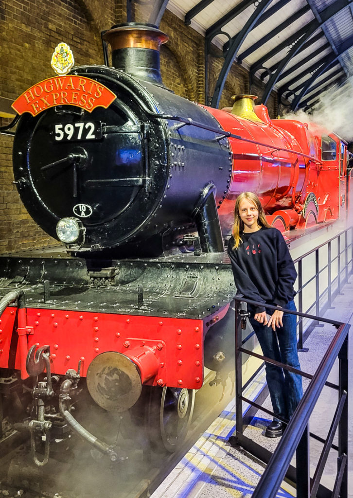 girl in front of Hogwarts Express at the Harry Potter Studio Tour