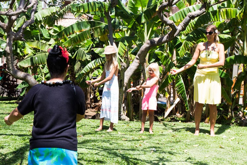 family taking Hula dancing lessons at Kaanapali Beach Hotel