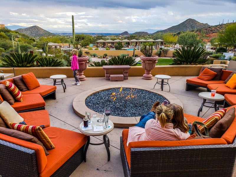 family sitting around firepit at J.W. Marriott Tucson Star Pass Resort & Spa, Tucson